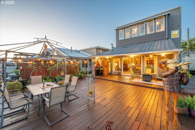 deck with outdoor dining area
