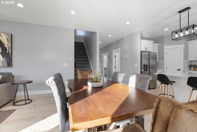 dining room with light wood-type flooring