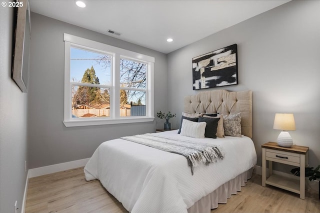 bedroom with light hardwood / wood-style floors