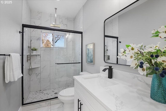 bathroom featuring toilet, walk in shower, and vanity