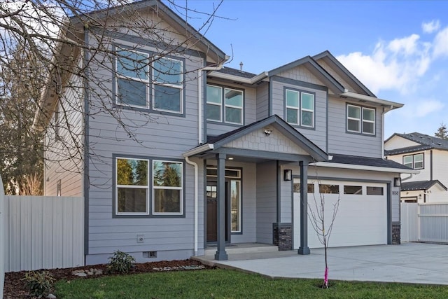 view of front facade with covered porch and a garage