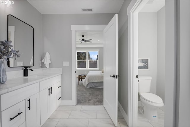 bathroom featuring toilet and vanity