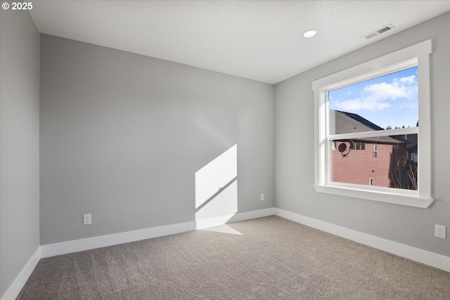 spare room featuring carpet flooring