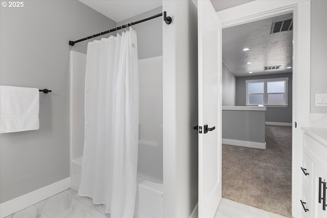 bathroom featuring vanity and shower / bath combination with curtain