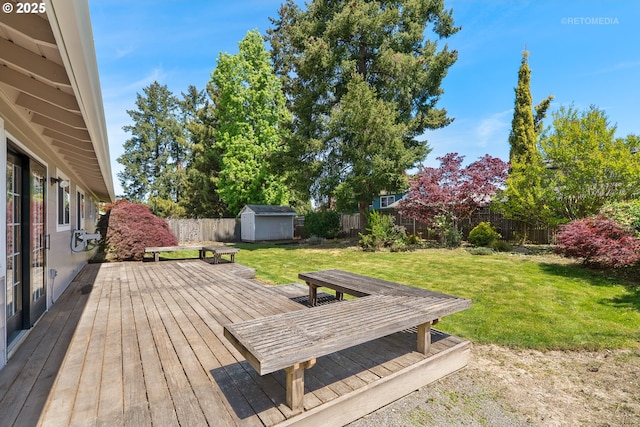 deck with a shed and an outdoor structure