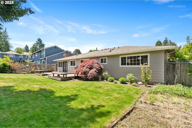 back of house featuring a deck