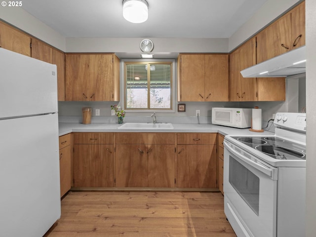 6229 NW Skyline Blvd, Portland, OR 97229 - kitchen with light wood-style flooring, a sink, white appliances, light countertops, and under cabinet range hood