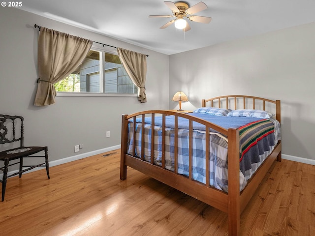 6229 NW Skyline Blvd, Portland, OR 97229 - bedroom with visible vents, baseboards, and wood finished floors