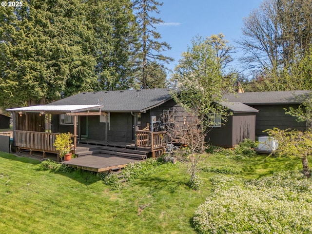 6229 NW Skyline Blvd, Portland, OR 97229 - rear view of property with a wooden deck, a lawn, and a shingled roof