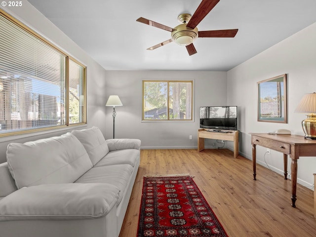 6229 NW Skyline Blvd, Portland, OR 97229 - living area featuring ceiling fan, baseboards, and light wood-style floors