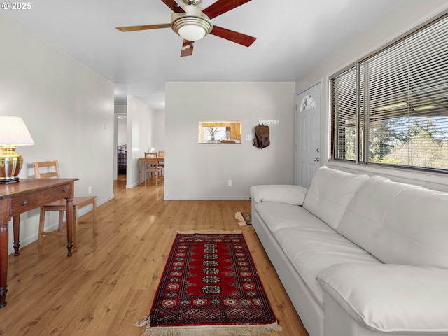 6229 NW Skyline Blvd, Portland, OR 97229 - living area featuring baseboards, a ceiling fan, and light wood-style flooring