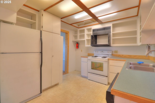 kitchen with white appliances, open shelves, a sink, light countertops, and light floors