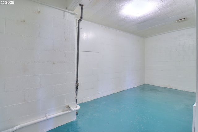 basement featuring concrete block wall