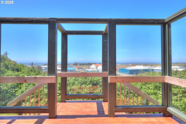exterior space featuring a deck with water view
