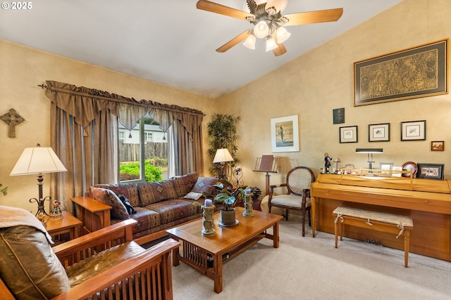 carpeted living room featuring vaulted ceiling and a ceiling fan
