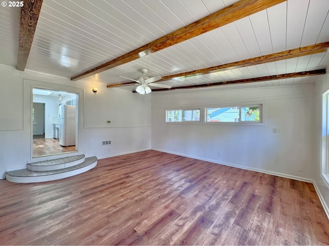 337 Spruce Dr, Brookings, OR 97415 - empty room with wood finished floors, baseboards, a ceiling fan, and wooden ceiling with exposed beams