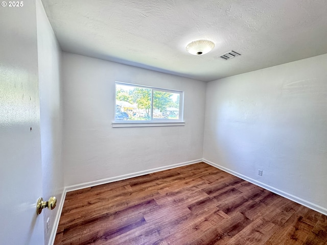 337 Spruce Dr, Brookings, OR 97415 - unfurnished room with wood finished floors and baseboards