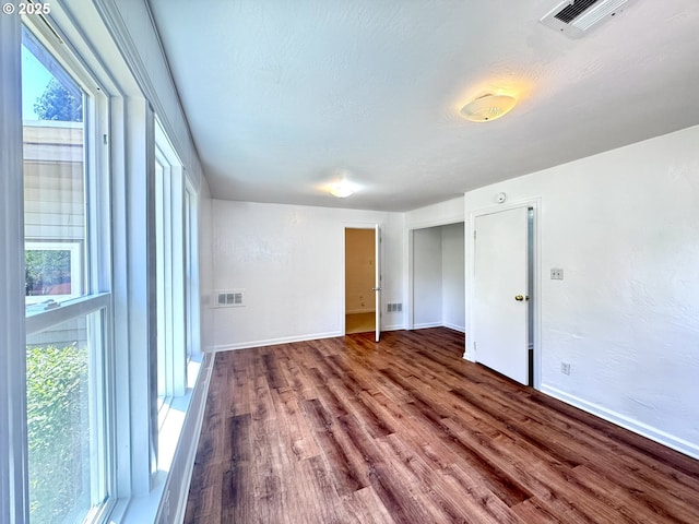 337 Spruce Dr, Brookings, OR 97415 - unfurnished bedroom featuring wood finished floors and baseboards