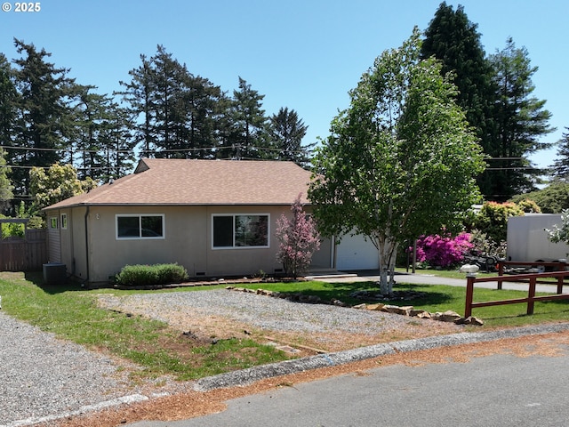 337 Spruce Dr, Brookings, OR 97415 - view of front facade featuring gravel driveway, an attached garage, roof with shingles, and central air condition unit
