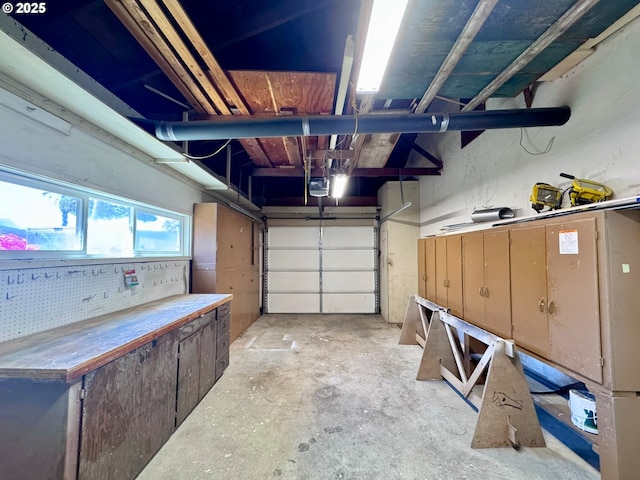 337 Spruce Dr, Brookings, OR 97415 - garage featuring a garage door opener