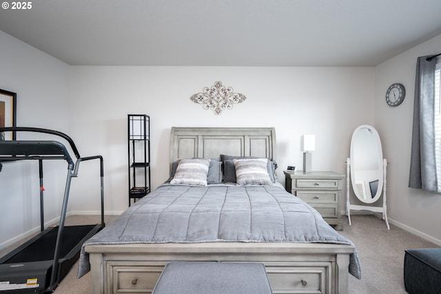 bedroom featuring baseboards and carpet