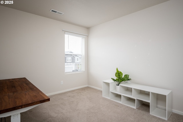 home office with visible vents, baseboards, and carpet floors