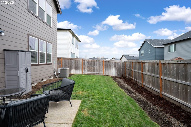 view of yard featuring central AC unit, a patio, and a fenced backyard