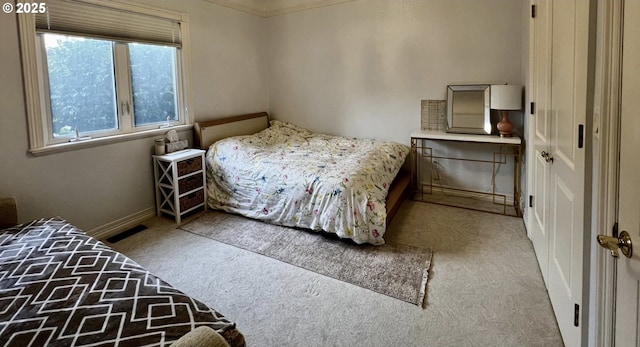 bedroom featuring carpet, visible vents, and baseboards