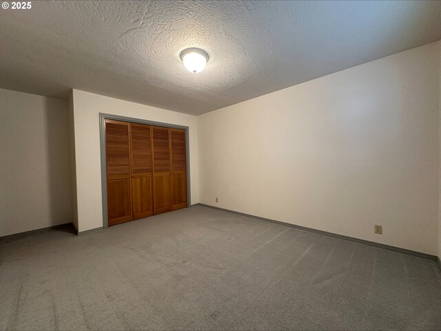 3115 Deer Trail Ln, Medford, OR 97501 - carpeted empty room featuring a textured ceiling and baseboards