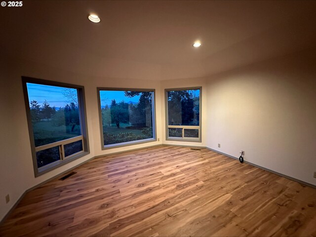 3115 Deer Trail Ln, Medford, OR 97501 - kitchen featuring under cabinet range hood, white appliances, light wood finished floors, a sink, and brown cabinets
