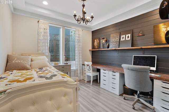 11712 Finnegans Way, Oregon City, OR 97045 - bedroom featuring light wood-style floors, a raised ceiling, an office area, a chandelier, and recessed lighting