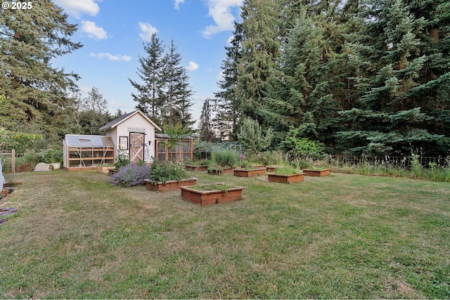 11712 Finnegans Way, Oregon City, OR 97045 - view of green lawn with a greenhouse, a vegetable garden, and an outdoor structure