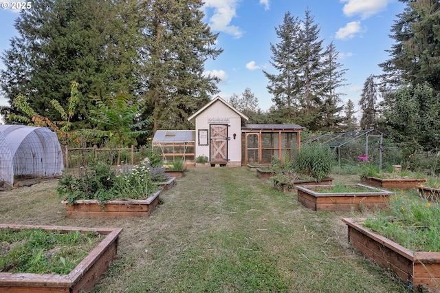 11712 Finnegans Way, Oregon City, OR 97045 - view of grassy yard featuring an exterior structure, a vegetable garden, and an outbuilding