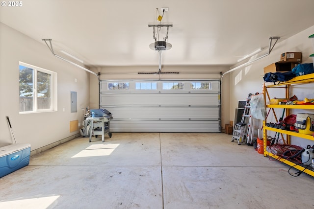 875 12th St SW, Bandon, OR 97411 - garage featuring electric panel and a garage door opener
