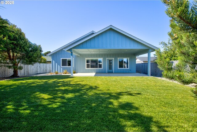875 12th St SW, Bandon, OR 97411 - rear view of house featuring a patio and a fenced backyard