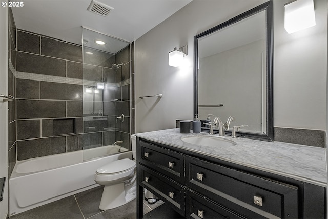 bathroom with vanity, tile patterned flooring, visible vents, toilet, and shower / bathing tub combination