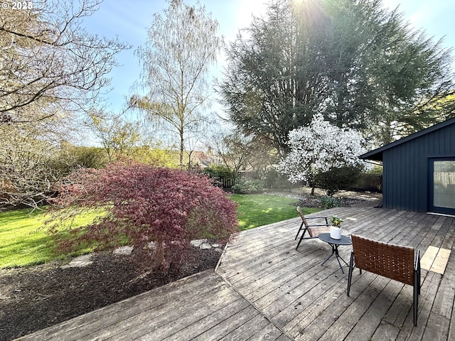 deck featuring a lawn