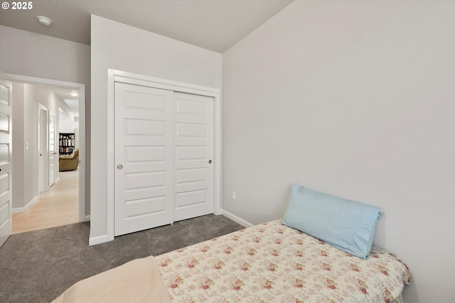 carpeted bedroom featuring a closet