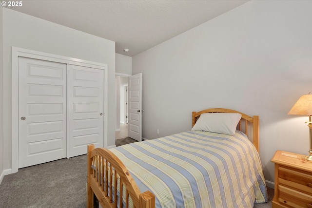 carpeted bedroom with a closet