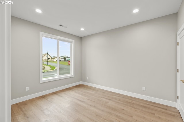 unfurnished room featuring light hardwood / wood-style floors