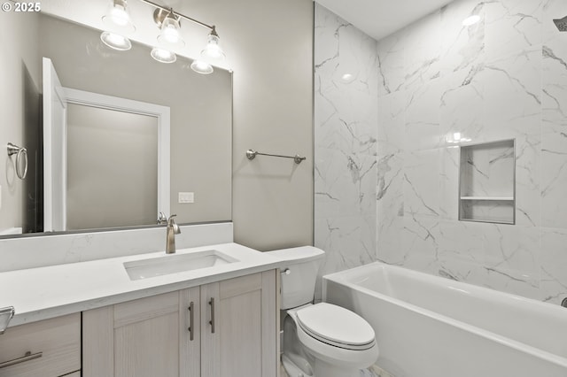 full bathroom with vanity, toilet, and tiled shower / bath combo