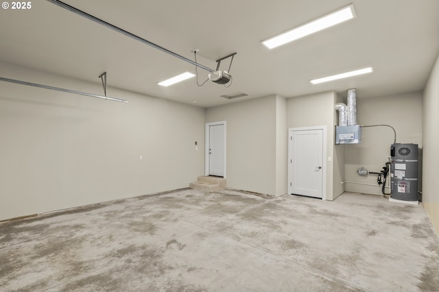 garage with electric panel and strapped water heater