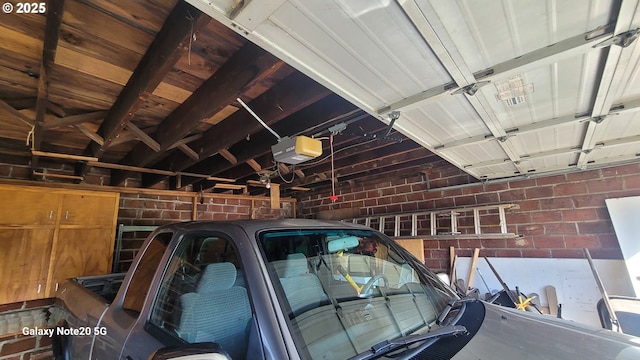 garage featuring a garage door opener