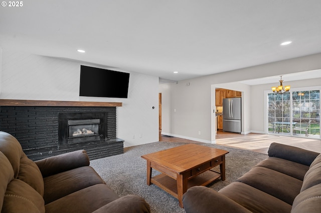 1524 SW 44th St, Pendleton, OR 97801 - living area with a chandelier, recessed lighting, a brick fireplace, and baseboards