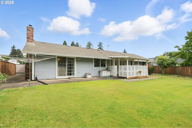 1362 NE 26th St, Gresham, OR 97030 - back of house with a fenced backyard, a chimney, and a sunroom