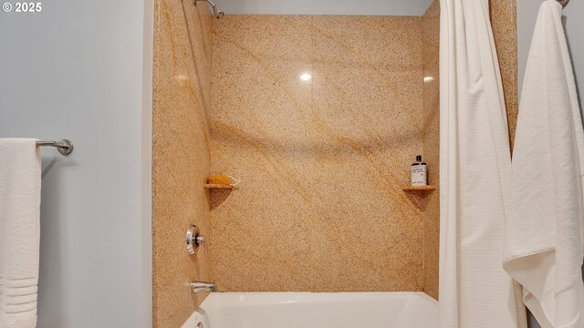 bathroom with shower / tub combo with curtain