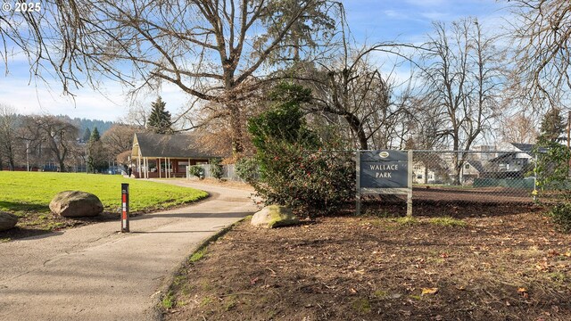 view of home's community with a yard