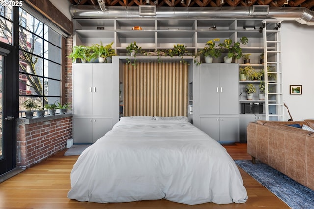 bedroom featuring wood-type flooring