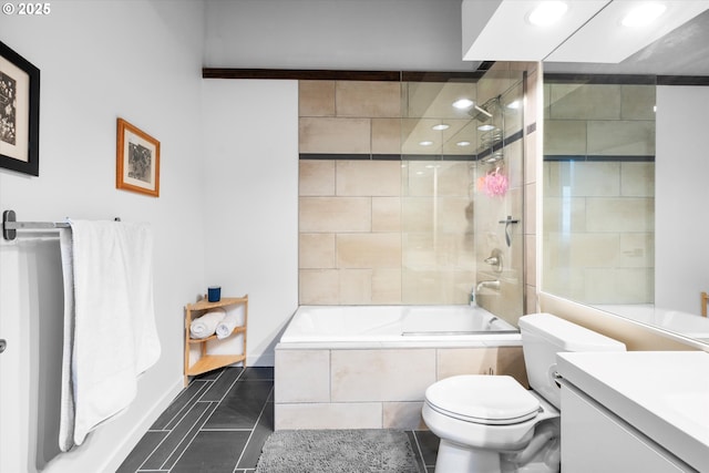 full bathroom with vanity, tiled shower / bath, tile patterned floors, and toilet