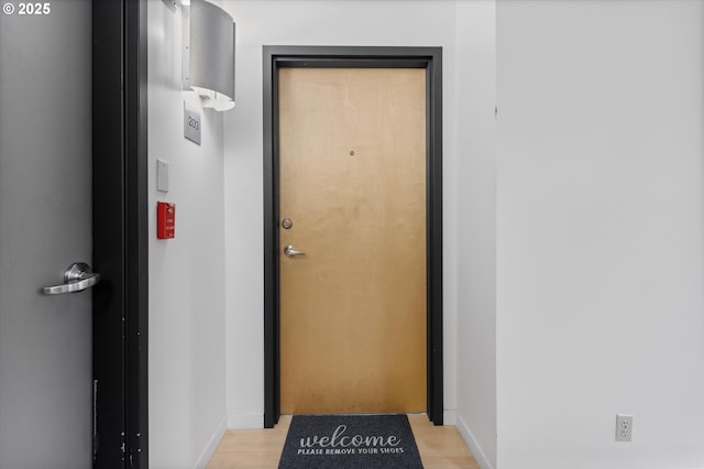 doorway to outside with light hardwood / wood-style floors